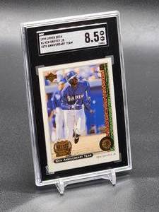 lot 121 image: 1999 Upper Deck Ken Griffey Jr 10th Anniversary Team Baseball Card #X6 SGC 8.5