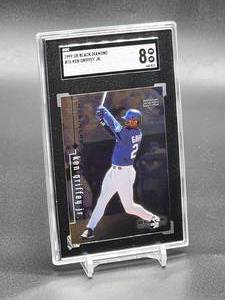 lot 115 image: 1999 Upper Deck Black Diamond Ken Griffey Jr Baseball Card #76 SGC 8