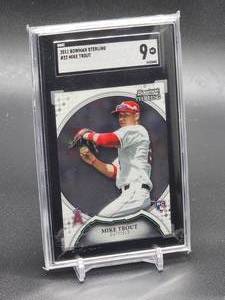 lot 64 image: 2011 Bowman Sterling Mike Trout Rookie Baseball Card #22 SGC 9