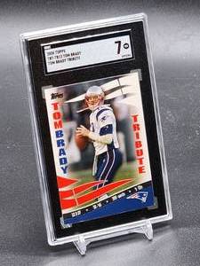 lot 45 image: 2008 Topps Tom Brady Tribute Football Card #TBT-TB13 SGC 7