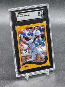 lot 77 image: 2002 Topps Rickey Henderson Baseball card #165 SGC 8