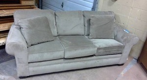 lot 26 image: Upholstered Sleeper Couch with tags still on it