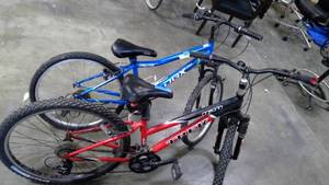 lot 68 image: OBX blue mountain bike and Trek 820 Mountain Bike