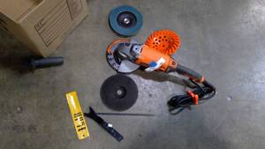 lot 160 image: Rigid 7 Corded twist handle angle grinder with spare discs