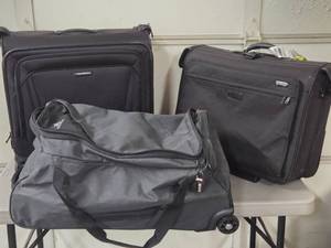 lot 239 image: Nice Group of Name Brand Suitcases Bags Luggage