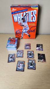 lot 36 image: Lot of 9 Baseball and Basketball Cards Featuring Eric Chavez, Tim Hudson, and DeMarcus Cousins and Kirby Puckett Wheaties Box