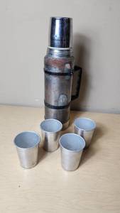 lot 64 image: Stanley Thermos with Four Aluminum Cups
