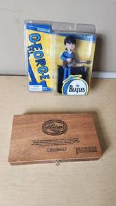 lot 82 image: McFarlane Toys The Beatles George Harrison Figure and Padron Wooden Cigar Box