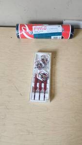 lot 91 image: Coca-Cola Brand Wall Covering and Night Rider Darts Set