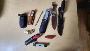 lot 107 image: Lot of Knives and Tools Including Buck Knife, Victorinox Swiss Army Knife, and Vintage Fixed Blade