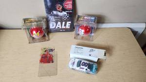 lot 110 image: NASCAR Collectibles Including Ertl Die-Cast Car, Dale JR and Jeff Gordon Ornaments, and Dale Earnhardt Documentary