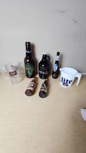 lot 157 image: Collection of Beer Memorabilia including Schlitz Pitcher, Budweiser Mardi Gras 2001 Bottle, and Bad Habit Brewing Growler