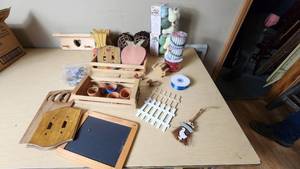 lot 161 image: Assorted Craft and Home Decor Items including Wooden Wall Decorations, Ribbon Spools, and Garden Accessories