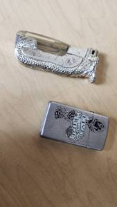 lot 195 image: Zippo Live to Ride and Electric Lighter