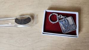 lot 201 image: NRA Freedom Keychain and 40 Years Commemorative Pin