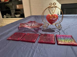 lot 36 image: Glass Pink Bowl (minor imperfections), Glass Hanging Heart Ornament and Four Glass Coasters