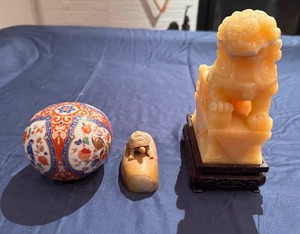 lot 38 image: Chinese Guardian Lion (Foo Dog) BookendFigurine, Carved Stone Turtle BookendFigurine, Kaiser West Germany Paperweight