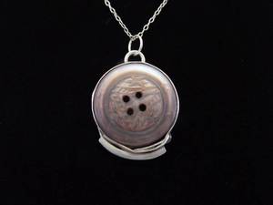 lot 20 image: .925 Sterling Silver Primitive Mother of Pearl Carved Button Pendant Necklace