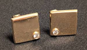lot 25 image: K - Pair of Cufflinks 14K Gold Diamond Bezel Square