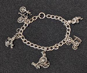 lot 65 image: K - Vintage Sterling Silver Charm Bracelet