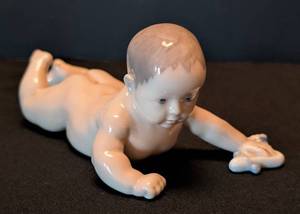 lot 157 image: K - Royal Copenhagen Lying Baby Figurine - Model 1739