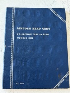 lot 11 image: Lincoln Cents and Book