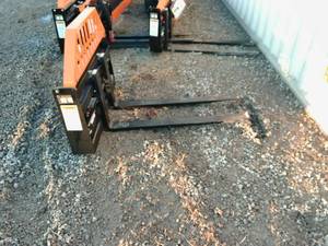 lot 30 image: WOLVERINE 48 POWER ADJUSTIBLE FORKS