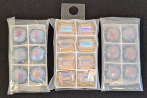 lot 27 image: Lot of 3 Packs Swarovski Sew On Crystals Assorted Shapes and Colors
