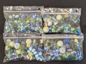 lot 28 image: 4 Bags of Assorted Glass Beads in Blue and Green Tones