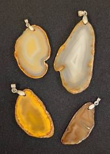 lot 35L image: Set of 4 Polished Stone Slice Pendants with Metal Bails