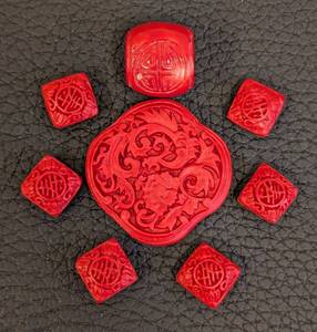 lot 88 image: Set of 6 Carved Red Beads - Floral and Symbol Motifs