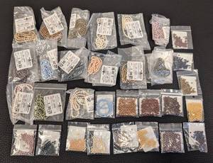 lot 92 image: Lot of 30 Fire Mountain Pearl Bead Packs, Assorted Colors and Sizes