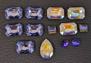 lot 103 image: Collection of 12 Swarovski Crystal Embellishments Assorted Shapes and Colors
