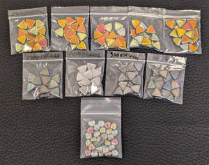 lot 104 image: Set of 9 Packs Triangle Glass Beads and 1 Pack Heart Shaped Glass Beads