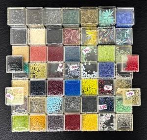 lot 34H image: W - Collection of Assorted Glass Beads in Various Colors and Sizes