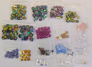 lot 134 image: Swarovski Marguerite Beads - 16 Packs - Assorted Crystal Colors