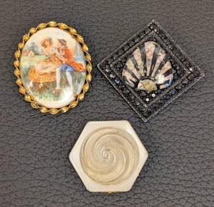 lot 142 image: Studio Beads Three Vintage Brooches Set - Painted Oval Scene, Black Geometric Fan & Hexagon