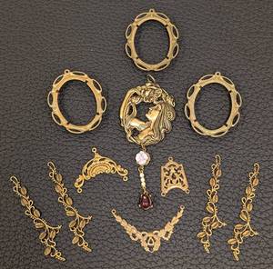lot 145 image: Gold-Tone Brass Jewelry Findings Lot - 4 Openwork Oval Frames, Central Portrait Pendant