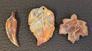 lot 191 image: Leaf Pendants Trio - Glass, Stone & Raku