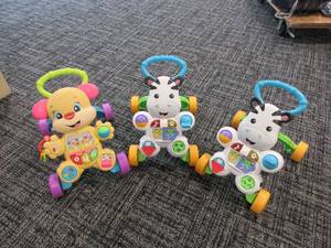 lot 730 image: MATTELFISHER PRICE CHILD WALKERS