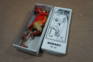 lot 102 image: Vintage Look Tin Litho Climbing Monkey