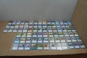 lot 176 image: 9 Pages of Magic the Gathering Trading Cards