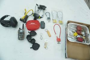 lot 84 image: Gun Locks, Headlamp, Ear Muffs, Slingshot, Walkie