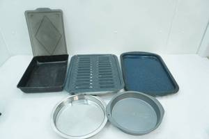lot 111 image: Broiling Pan, Covered Cake Pan, Metal Pie Plates