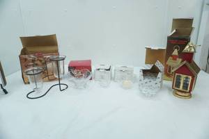 lot 124 image: Mikasa heart candle holder, Hurricane Kerosene Church Lantern, star candle holders, lead crystal Votive holders, Wrought Iron & glass candle holders