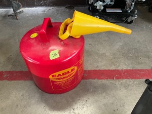 lot 218 image: Metal gas can with funnel