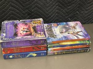 lot 45 image: Lot of 9 Hardcover Middle-Grade Books The Land of Stories Series, Spirit Animals & The Adventurers Guild