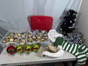 lot 102 image: Christmas Ornaments, Mini Tree, Stocking Hangers, Stockings, and More