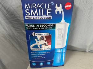lot 154 image: New Miracle Smile Water Flosser