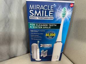 lot 225 image: New Miracle Smile Sonic Electric Toothbrush